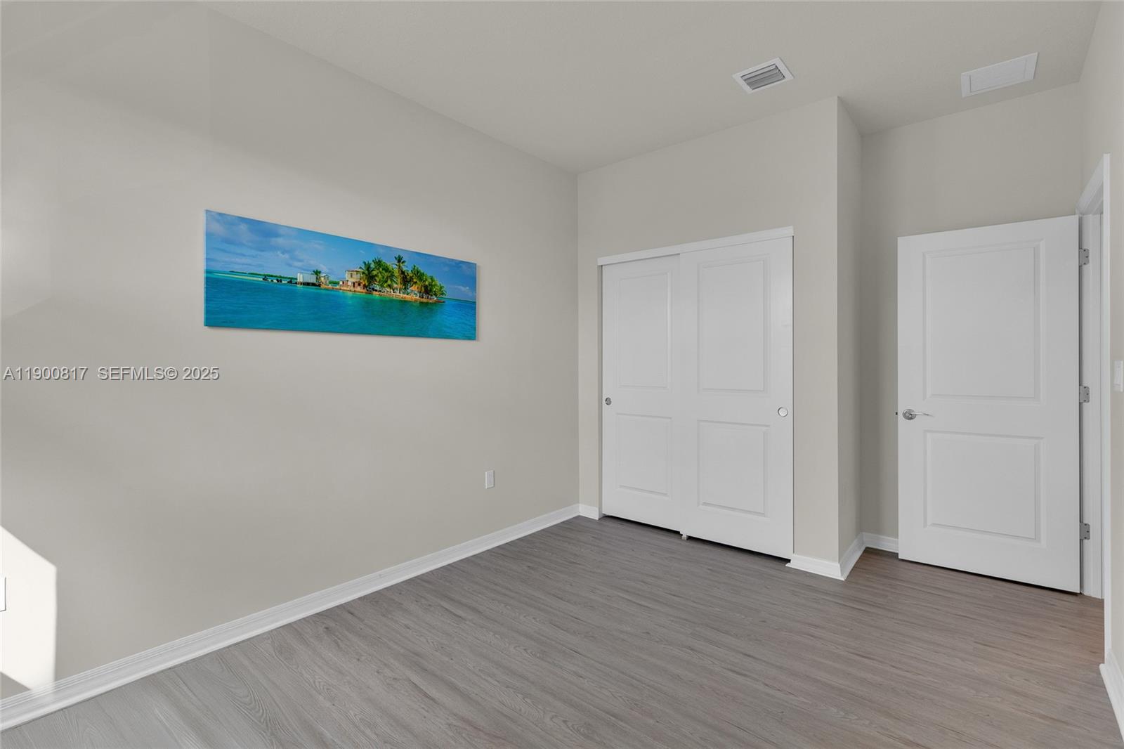 4810 Eucalyptus Drive, Unit 3 Hollywood, FL 33021 - Photo 18 of 32 an empty room with wooden floor