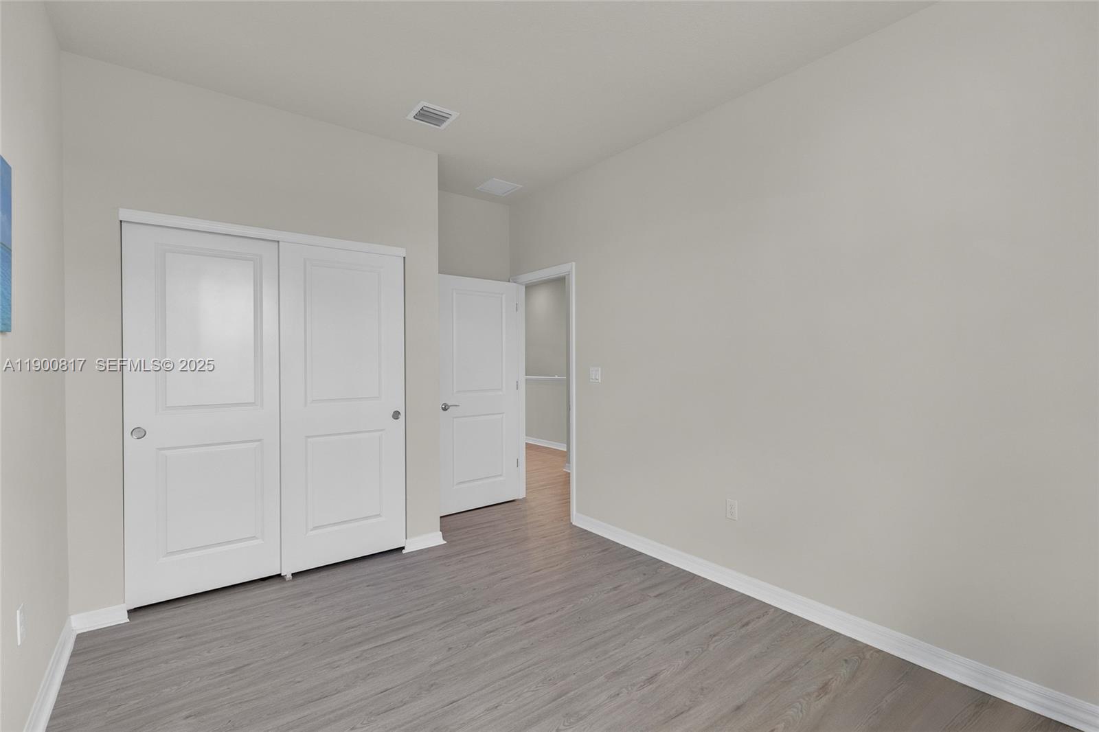 4810 Eucalyptus Drive, Unit 3 Hollywood, FL 33021 - Photo 19 of 32 a view of an empty room and wooden floor