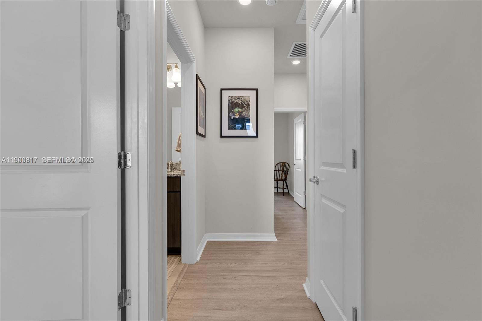 4810 Eucalyptus Drive, Unit 3 Hollywood, FL 33021 - Photo 23 of 32 a view of a hallway with wooden floor and closet