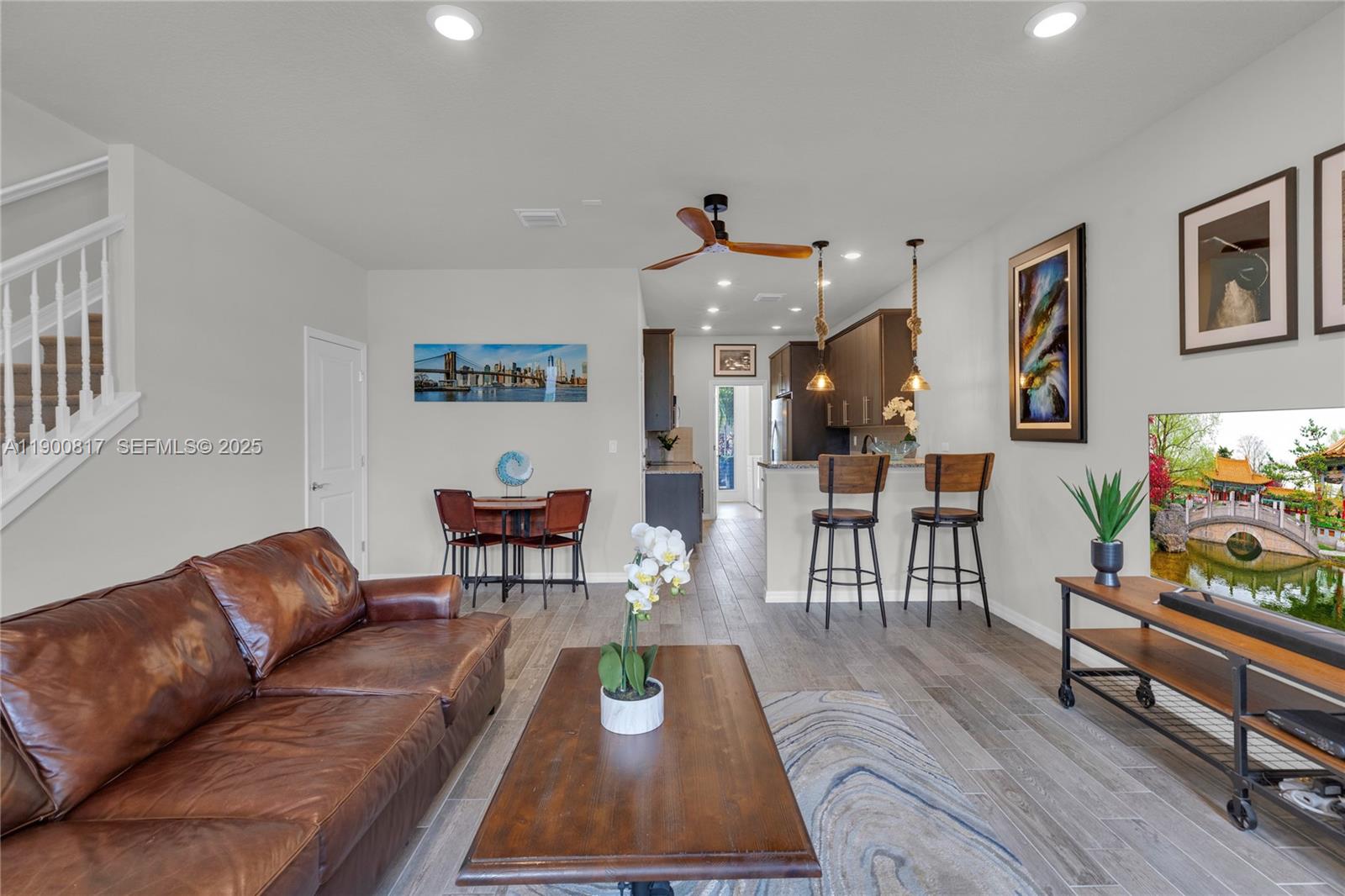 4810 Eucalyptus Drive, Unit 3 Hollywood, FL 33021 - Photo 4 of 32 a living room with furniture and wooden floor