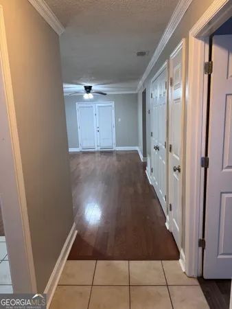 a view of a hallway with staircase