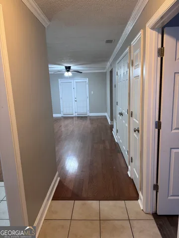 a view of a hallway with staircase