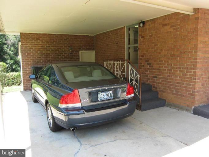 604 Lowander Lane Silver Spring, MD 20901 - Photo 25 of 30 Carport with steps up to kitchen door