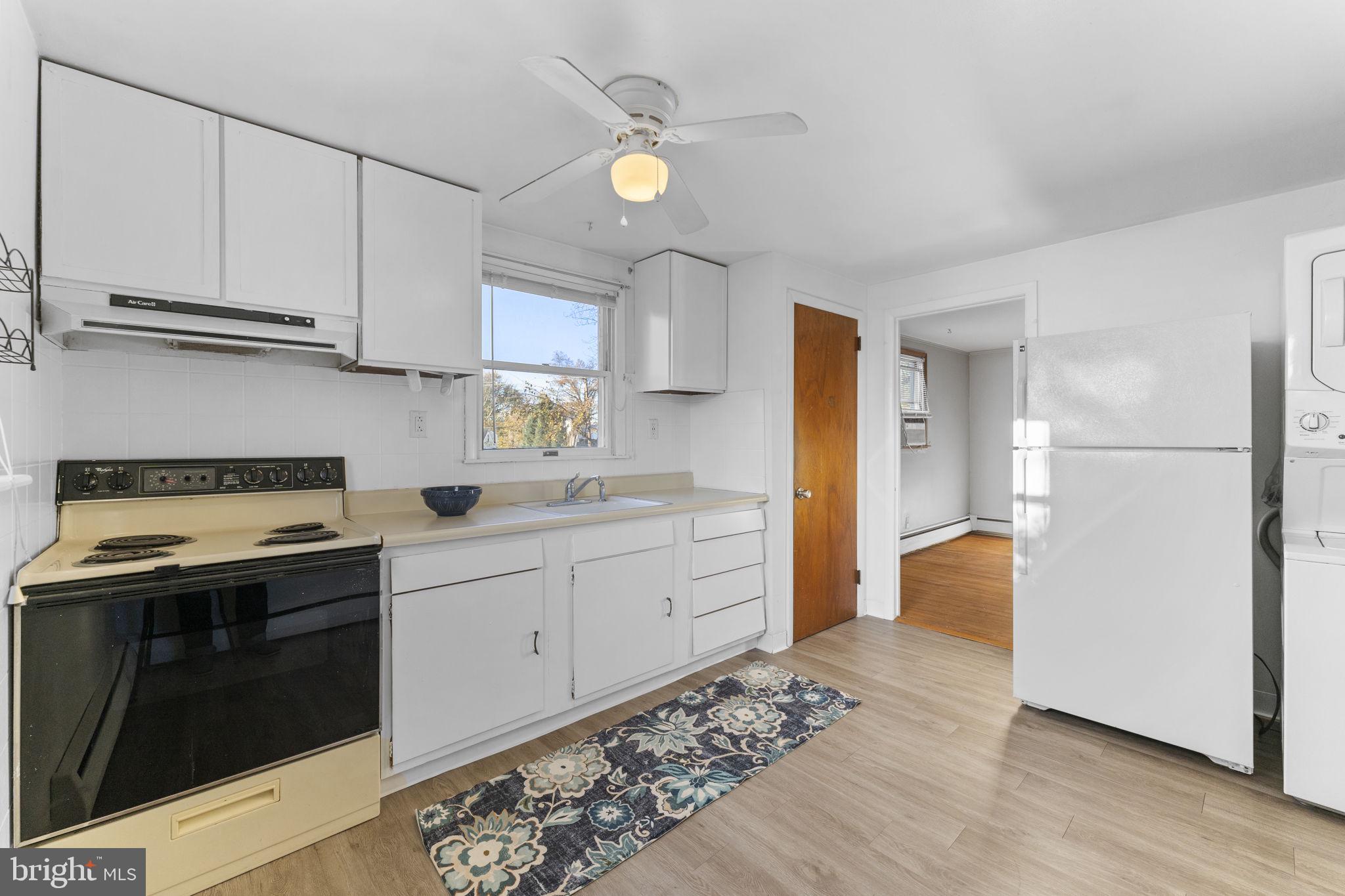 225 Pershing Avenue, Unit A Horsham, PA 19044 - Photo 11 of 19 a kitchen with a sink stove and refrigerator