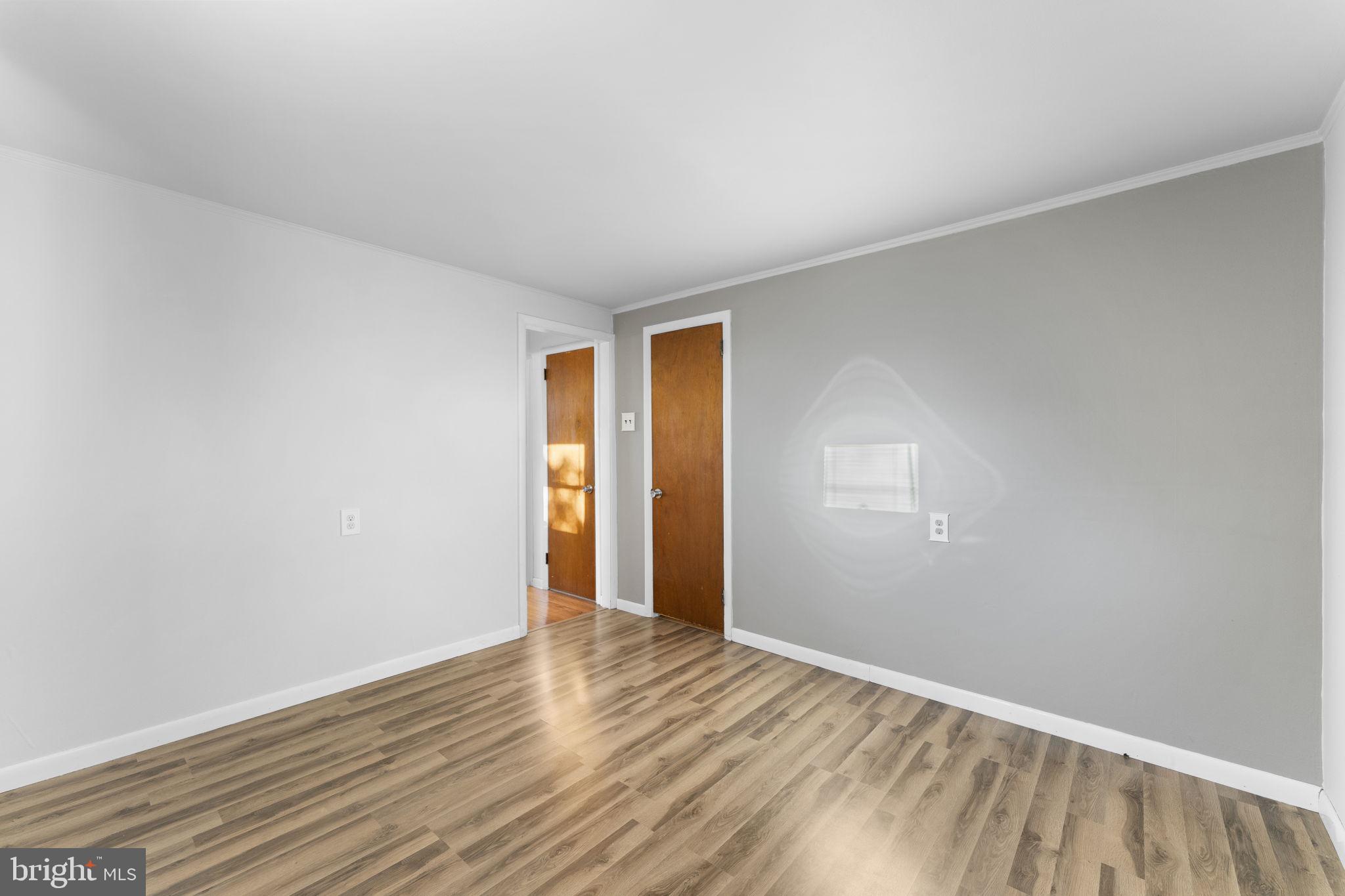 225 Pershing Avenue, Unit A Horsham, PA 19044 - Photo 16 of 19 a view of an empty room with wooden floor and closet