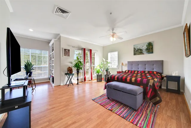 a living room with furniture fireplace and wooden floor