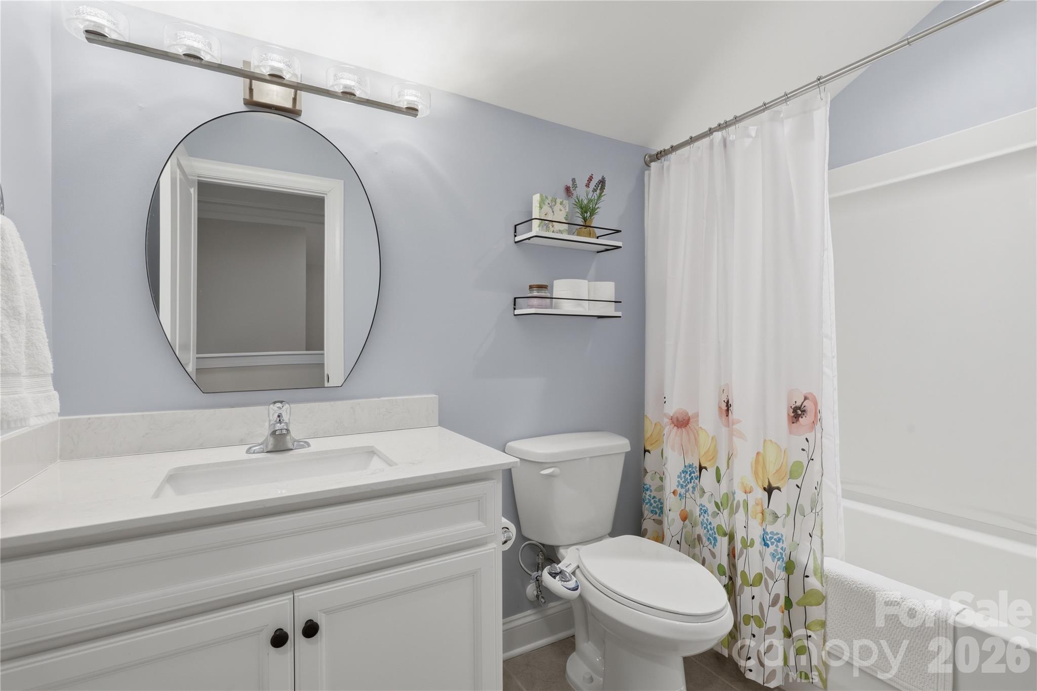 3023 Eagle Ridge Lane Indian Trail, NC 28079 - Photo 36 of 47 a bathroom with a toilet sink and mirror