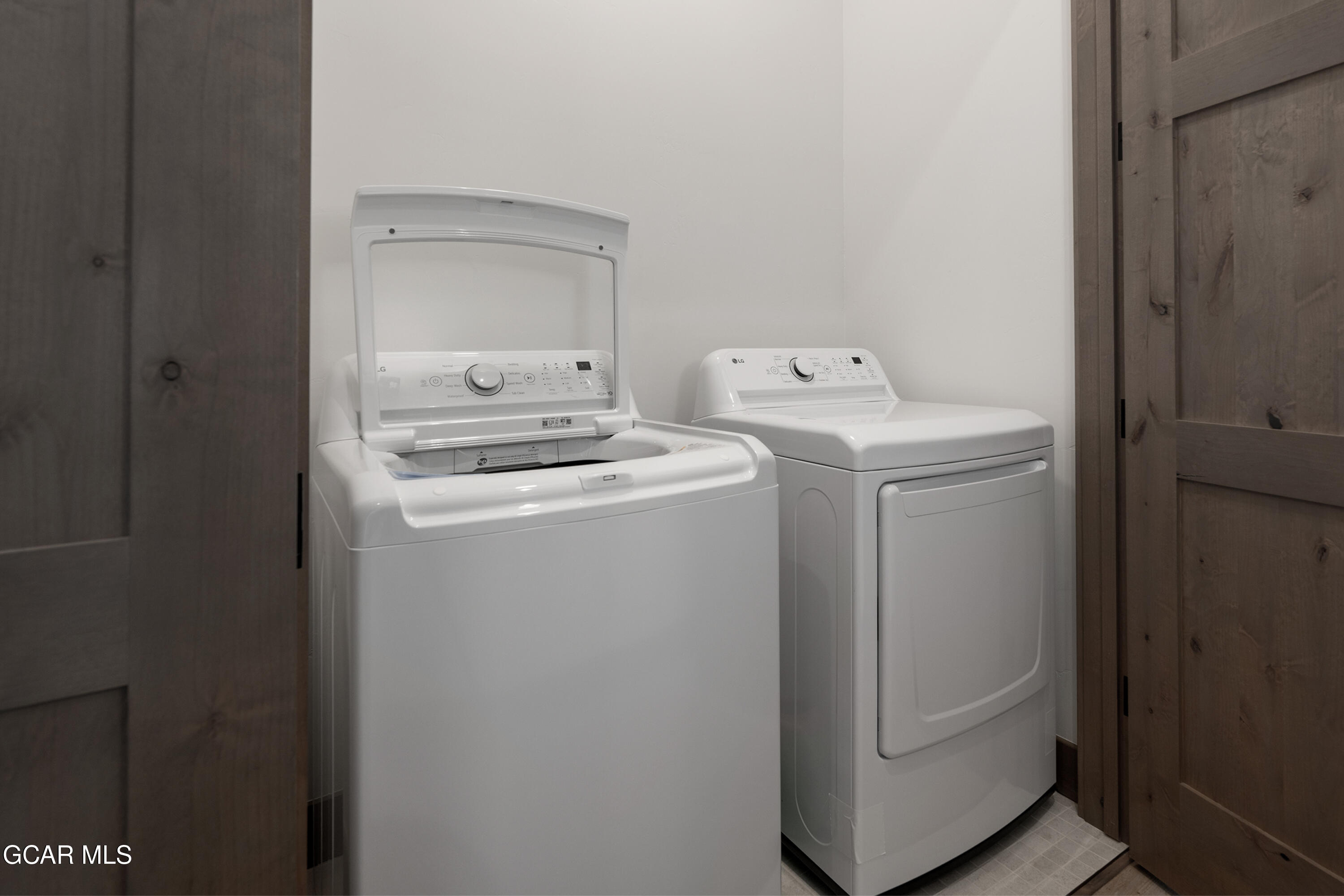 96 Meadow Trail, Unit G304 Fraser, CO 80442 - Photo 29 of 37 a utility room with dryer and washer