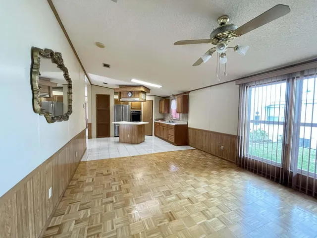 a bathroom with a glass shower door and a glass door