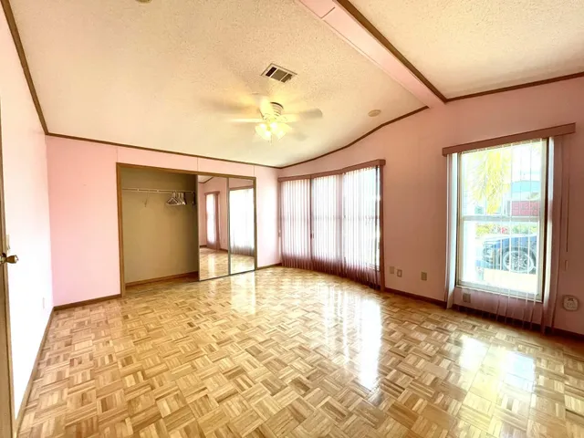 a view of a patio with a table chairs and a fire pit