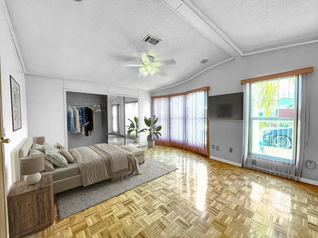 a view of a lake with houses in the back