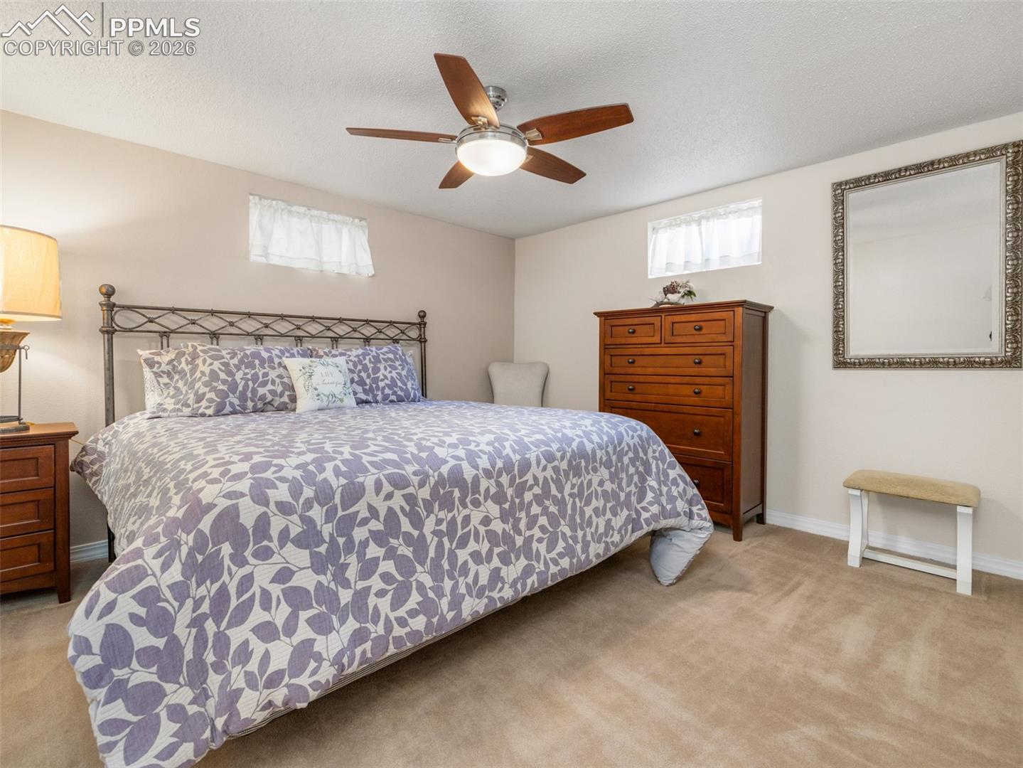 20 Robertson Road Pueblo, CO 81001 - Photo 21 of 39 Bedroom with light carpet, a textured ceiling, and a ceiling fan
