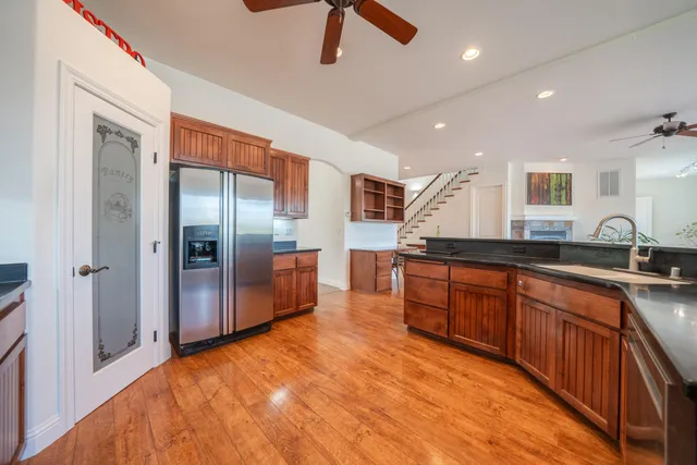 a dining room with furniture and wooden floor
