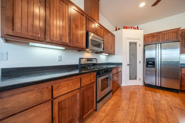 a bathroom with a toilet a sink and a mirror