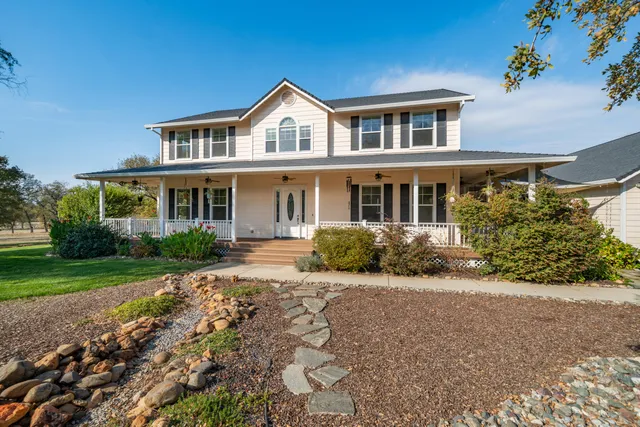 front view of a house with a yard