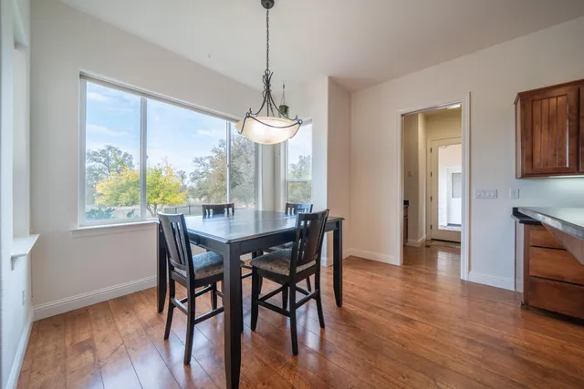 a view of a livingroom with a ceiling fan and window