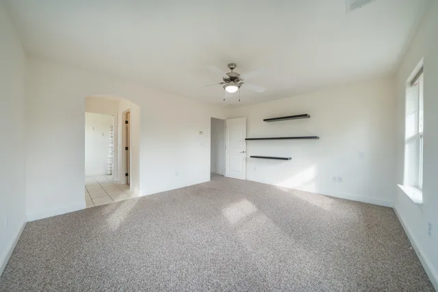 a view of a swimming pool with a table and chairs