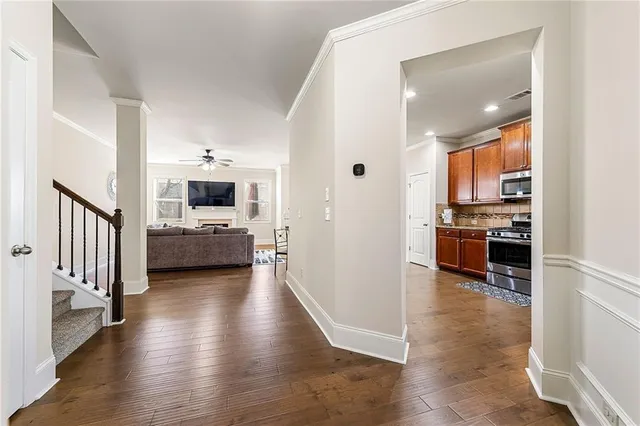 a view of a kitchen with a sink stove and cabinets