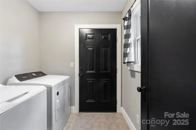 a front view of a house with washer and dryer