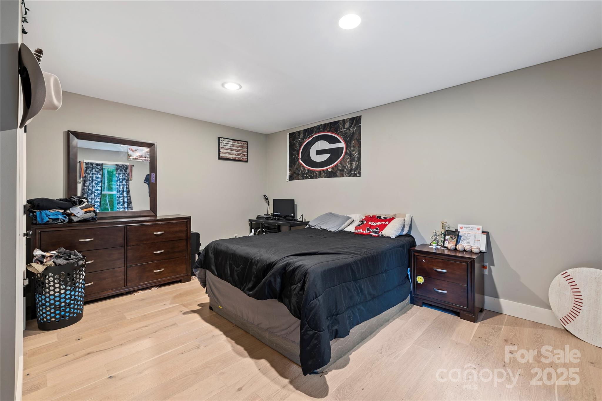 185 Ben Nevis Road Brevard, NC 28712 - Photo 24 of 42 a bedroom with a bed and a dresser