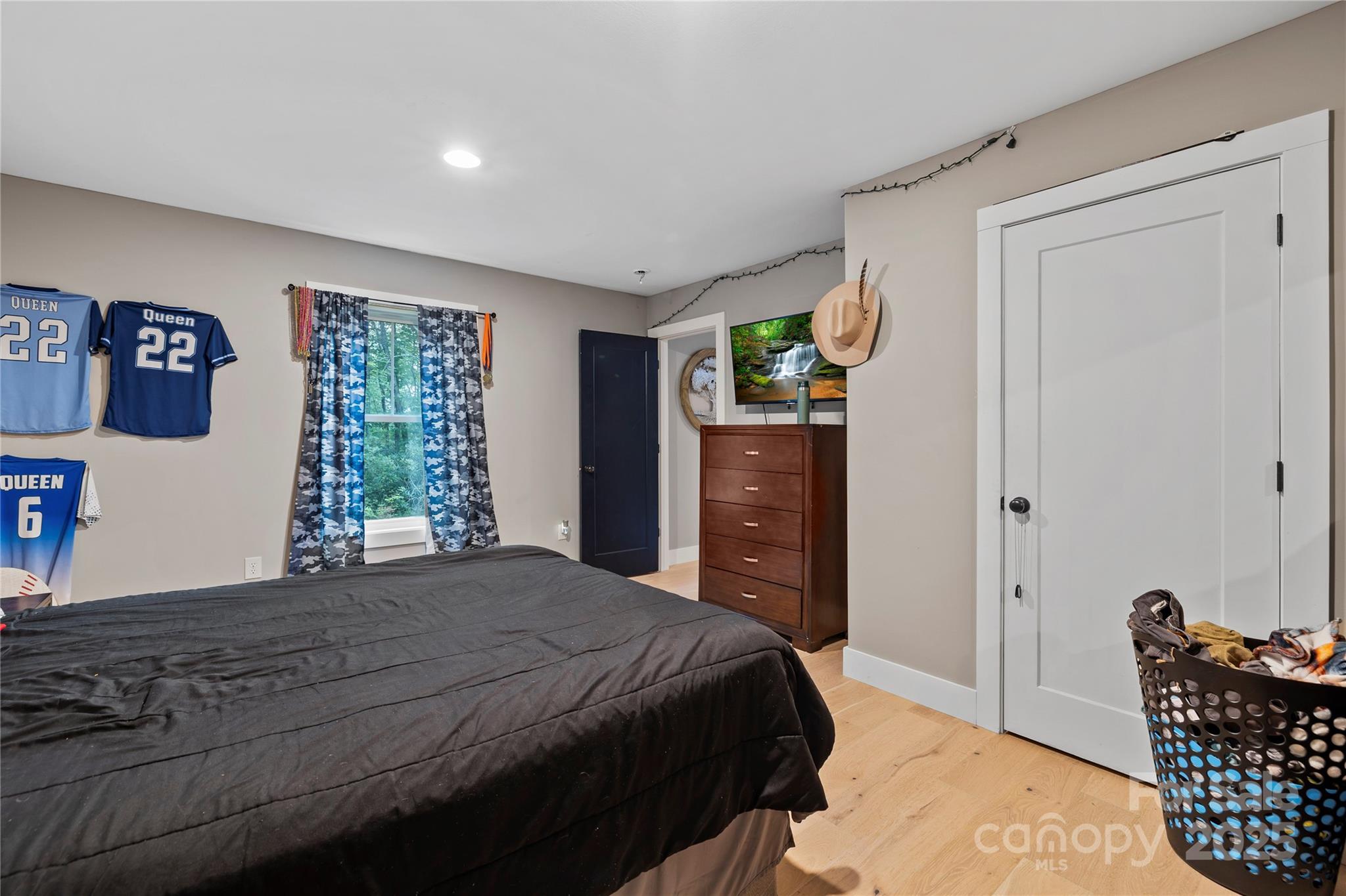 185 Ben Nevis Road Brevard, NC 28712 - Photo 25 of 42 a bedroom with a bed dresser and a window