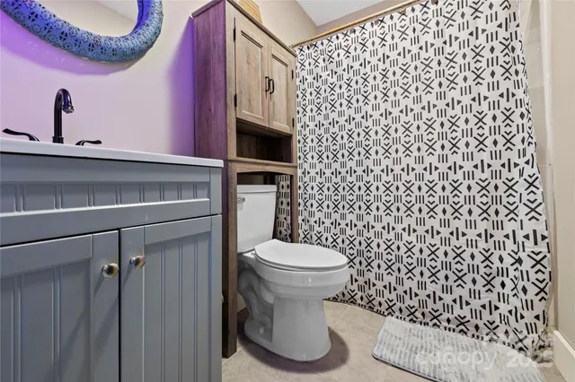 a view of a garage with rack and bicycle