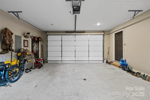 a view of a house with a yard and garage