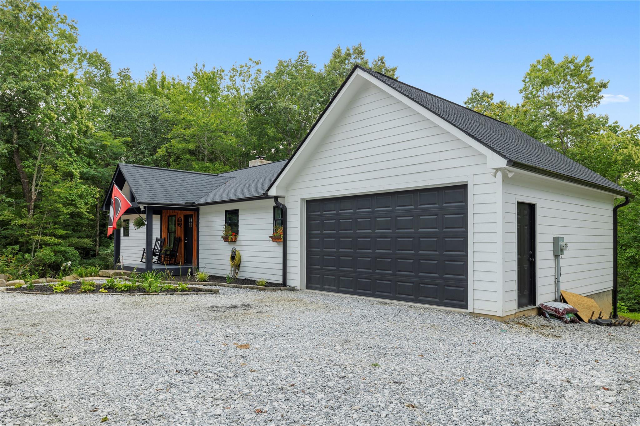 185 Ben Nevis Road Brevard, NC 28712 - Photo 28 of 42 a view of a house with a yard and garage
