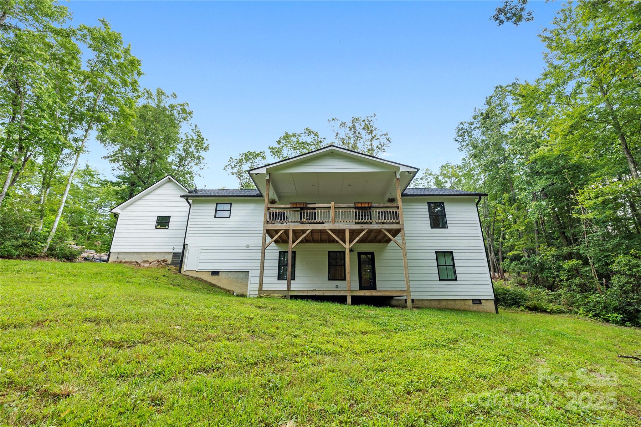 185 Ben Nevis Road Brevard, NC 28712 - Photo 30 of 42 a front view of a house with garden