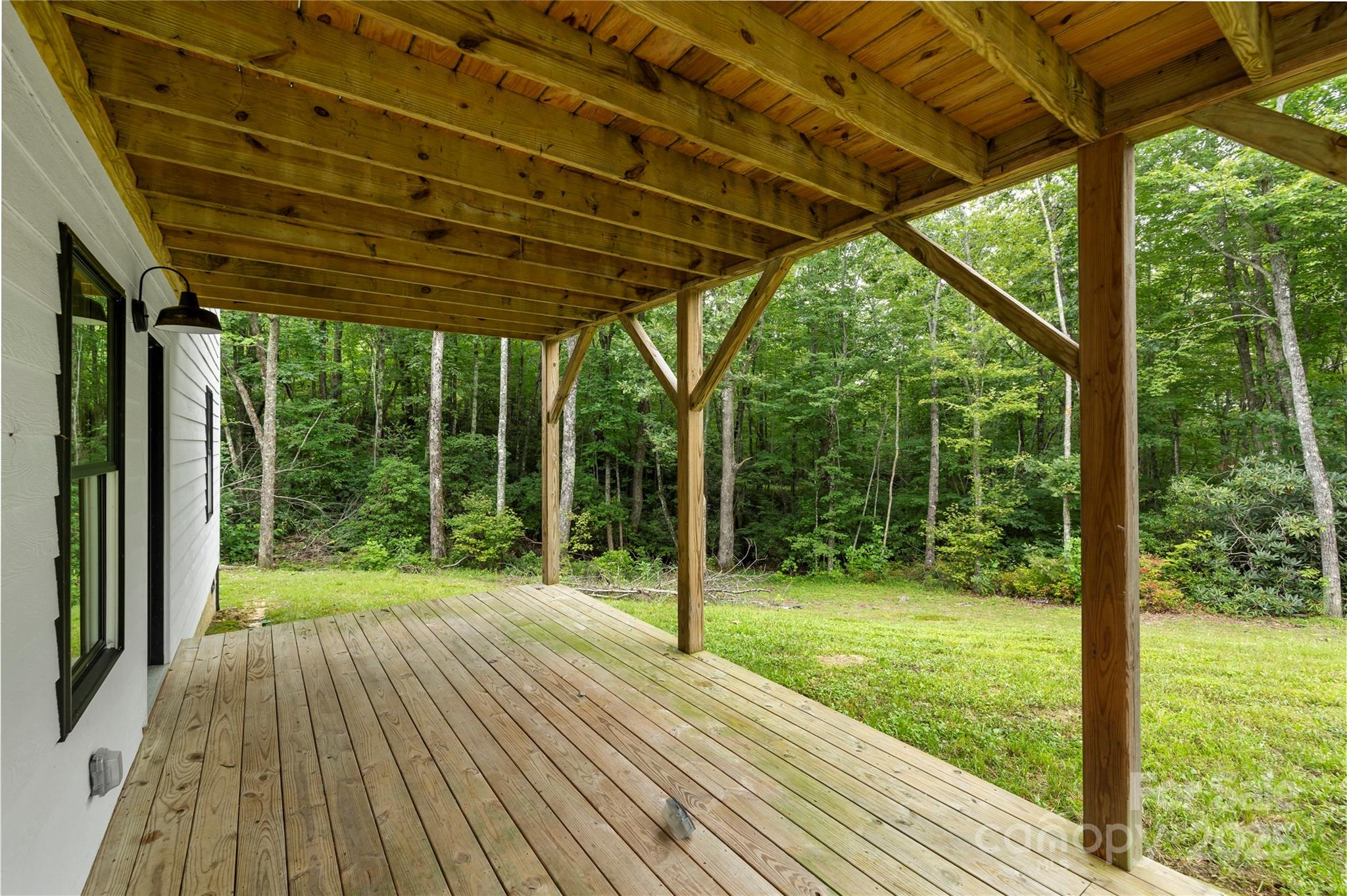 185 Ben Nevis Road Brevard, NC 28712 - Photo 34 of 42 a view of porch with a backyard