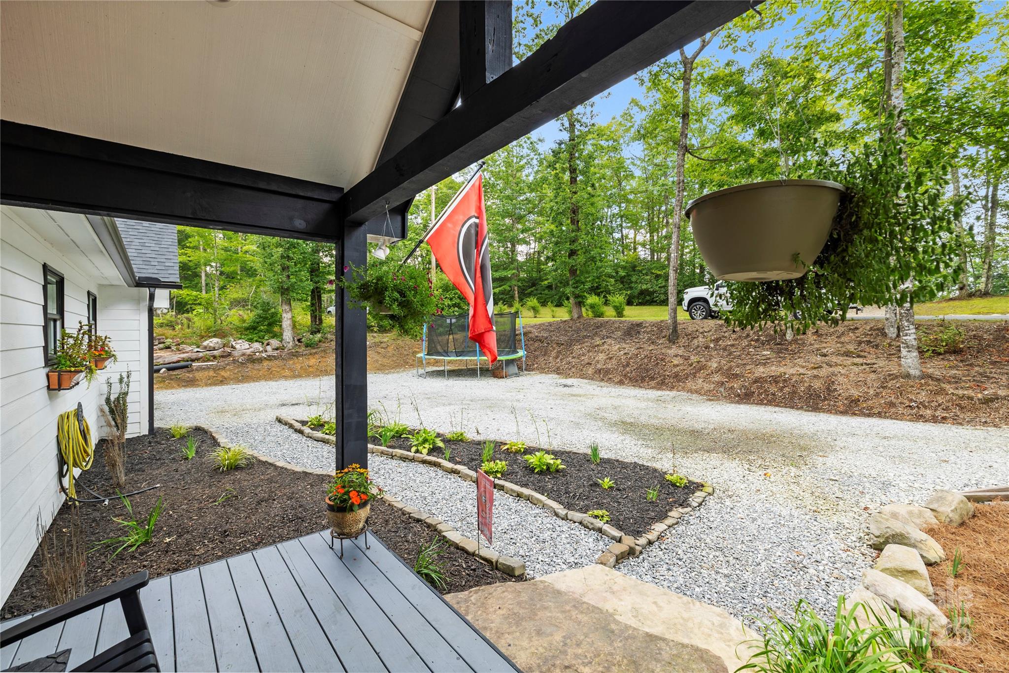 185 Ben Nevis Road Brevard, NC 28712 - Photo 4 of 42 a view of a porch with furniture and a yard