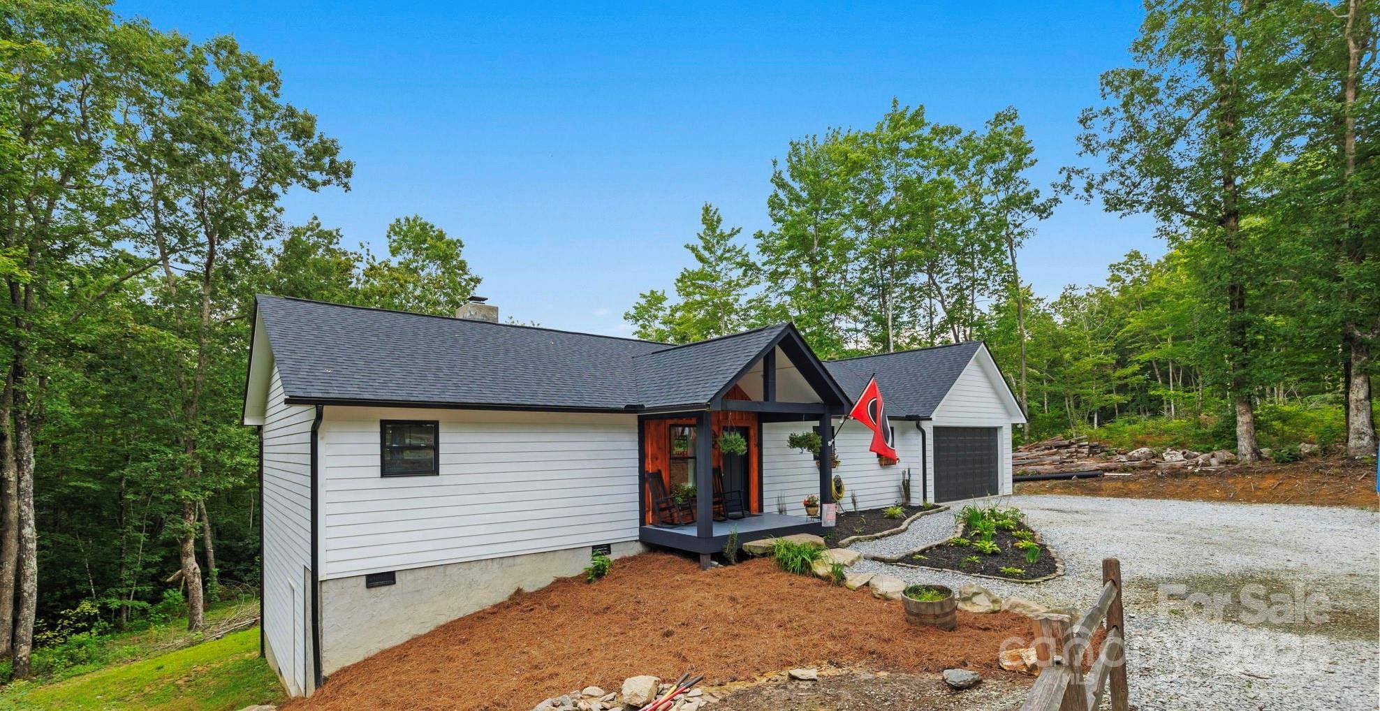 185 Ben Nevis Road Brevard, NC 28712 - Photo 41 of 42 a view of house with outdoor space and sitting area