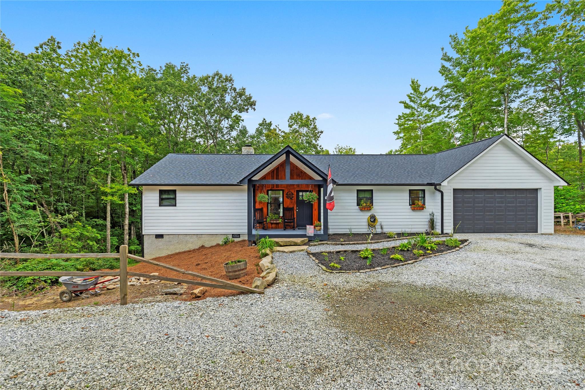185 Ben Nevis Road Brevard, NC 28712 - Photo 42 of 42 a view of house with wooden fence and a yard