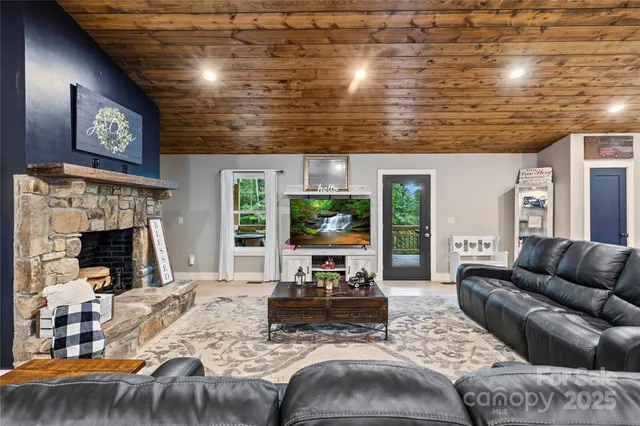 a living room with furniture and kitchen view