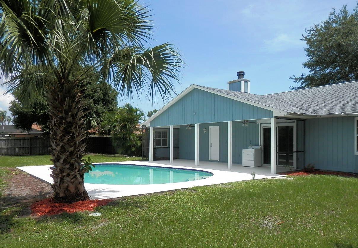 2252 Southeast Flanders Road Port St. Lucie, FL 34952 - Photo 2 of 24 POOL WITH COVERED BACK PORCH