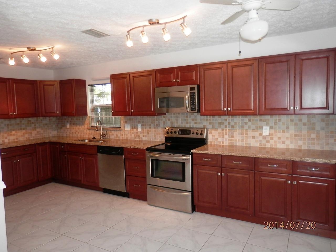 2252 Southeast Flanders Road Port St. Lucie, FL 34952 - Photo 3 of 24 REMODELED KITCHEN w/ UPGRAGED CABINETS