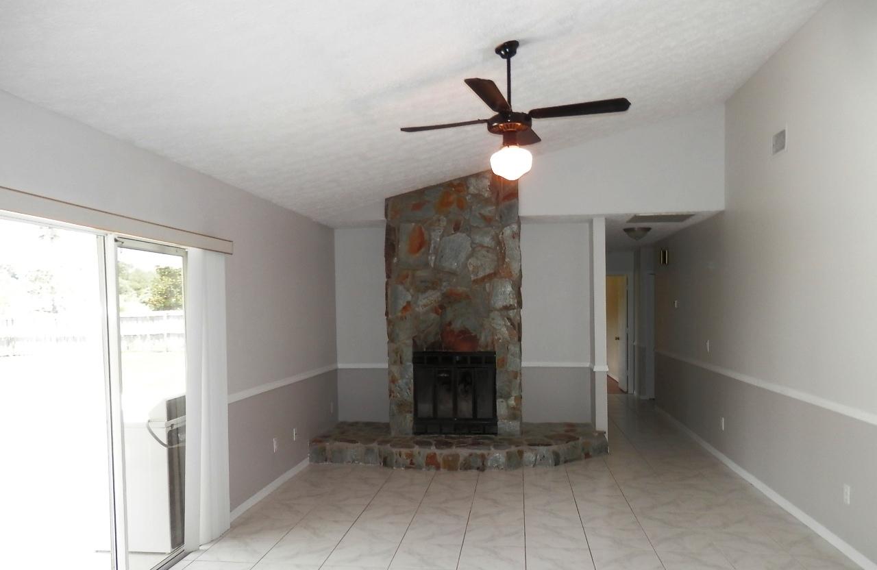 2252 Southeast Flanders Road Port St. Lucie, FL 34952 - Photo 4 of 24 FIREPLACE IN FAMILY ROOM