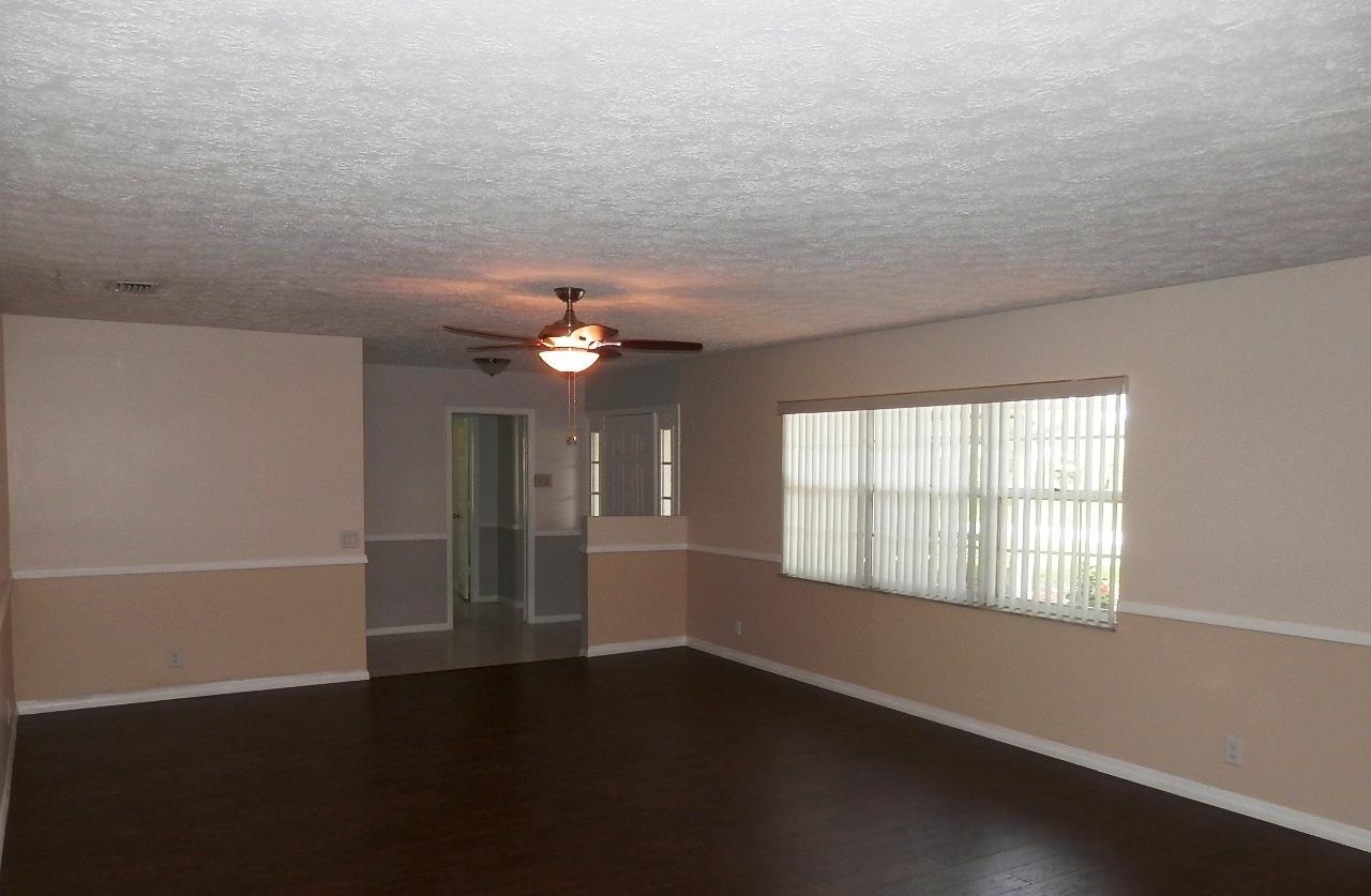 2252 Southeast Flanders Road Port St. Lucie, FL 34952 - Photo 5 of 24 LIVING ROOM AND ENTRY
