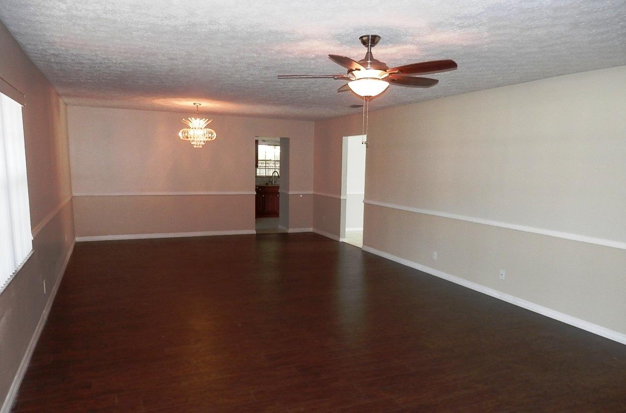 2252 Southeast Flanders Road Port St. Lucie, FL 34952 - Photo 6 of 24 LIVING ROOM AND DINING ROOM