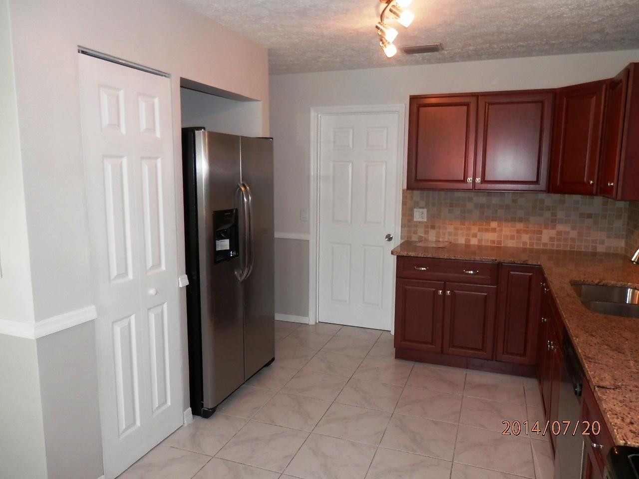 2252 Southeast Flanders Road Port St. Lucie, FL 34952 - Photo 8 of 24 GRANITE, TILE BACKSPLACE, STAINLESS APPL
