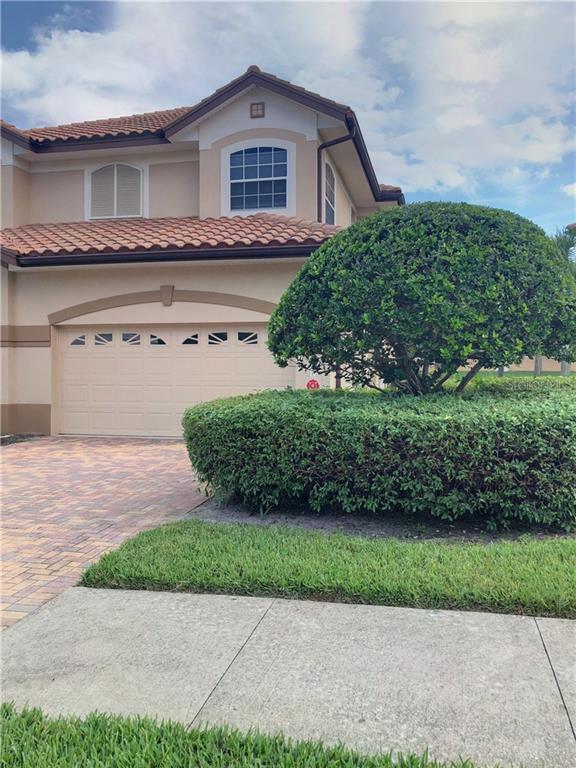 8441 Miramar Way, Unit 204 Lakewood Ranch, FL 34202 - Photo 1 of 1 a front view of a house with a yard