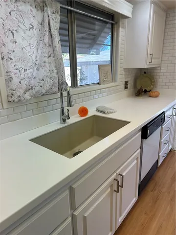 a view of living room with furniture and window