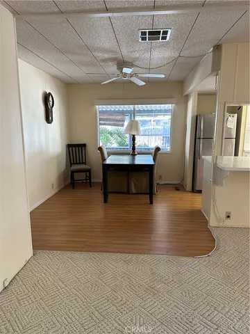 a view of bedroom with wooden floor
