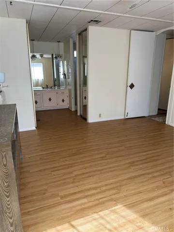 a bathroom with a double vanity sink a mirror and shower