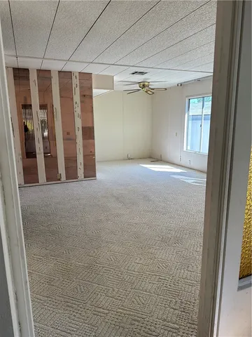 a view of an empty room with a window