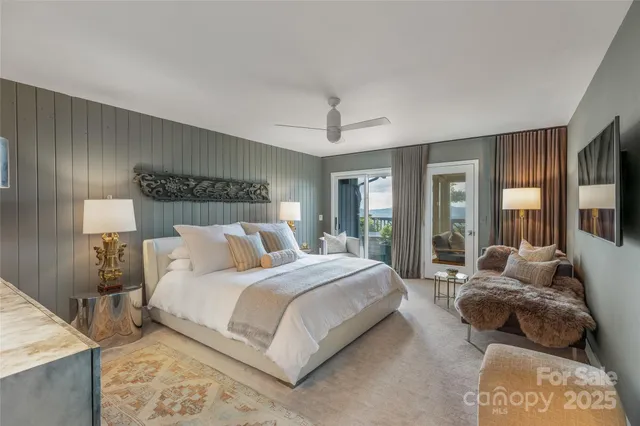 a bedroom with a large bed and a large window