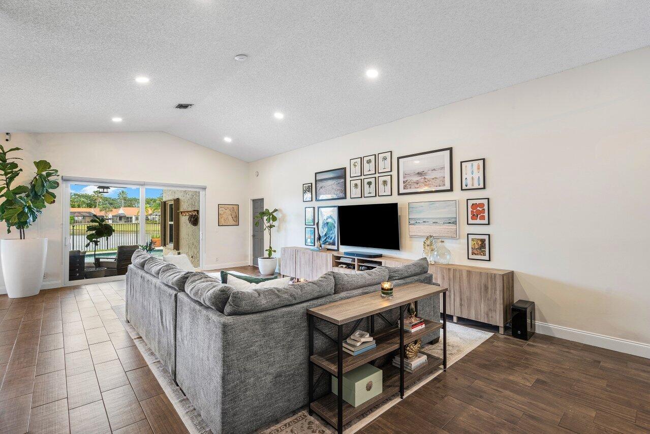8541 Nadmar Avenue Boca Raton, FL 33434 - Photo 16 of 39 a living room with furniture and a flat screen tv
