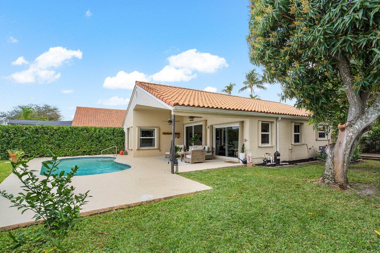 8541 Nadmar Avenue Boca Raton, FL 33434 - Photo 30 of 39 a view of a house with backyard sitting area and garden