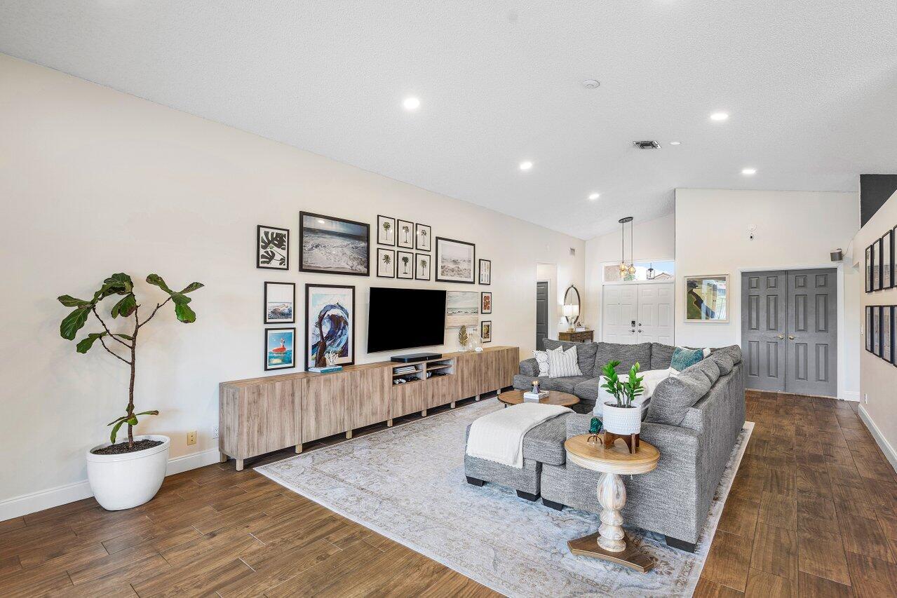 8541 Nadmar Avenue Boca Raton, FL 33434 - Photo 4 of 39 a living room with furniture and a flat screen tv