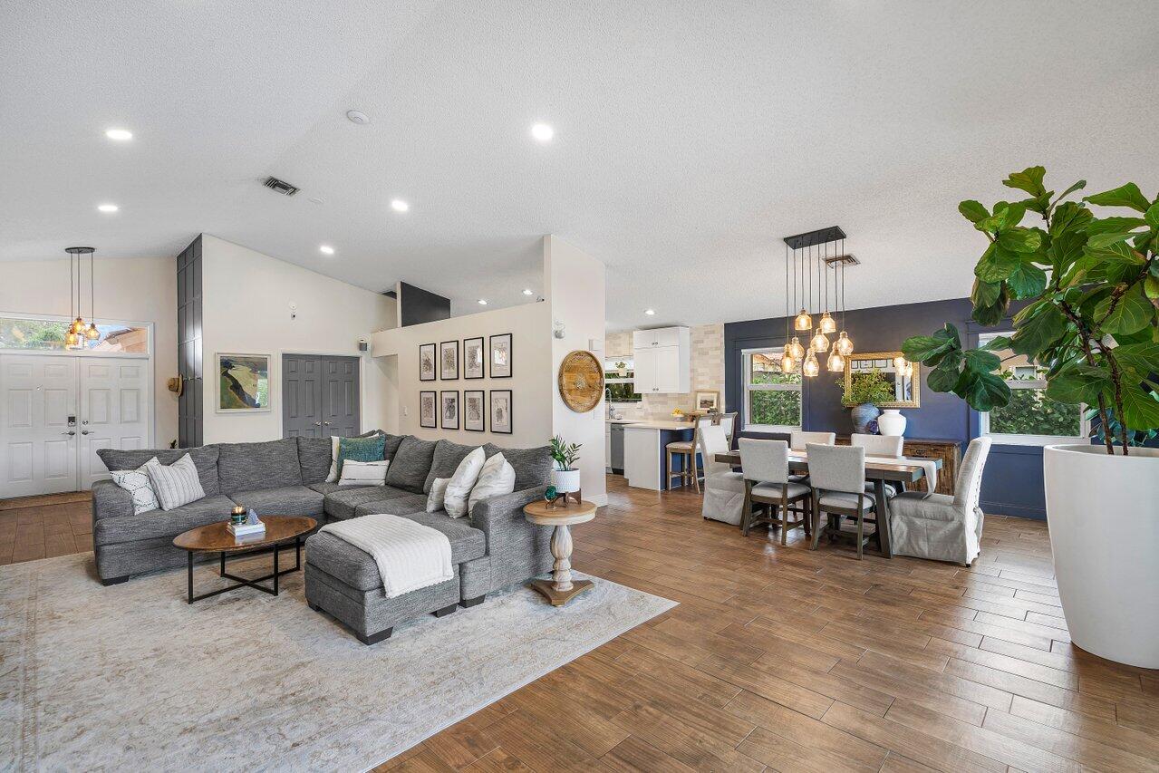 8541 Nadmar Avenue Boca Raton, FL 33434 - Photo 5 of 39 a living room with furniture and a large window